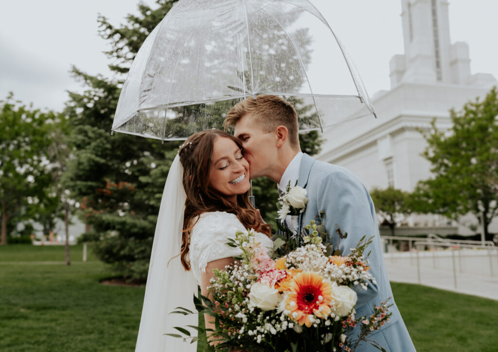 a bride and groom kissing after they just got married