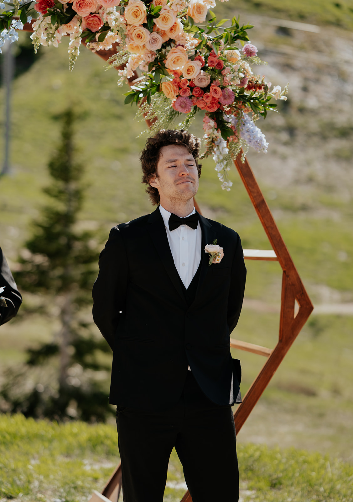 a groom crying when he sees his bride walking down the aisle