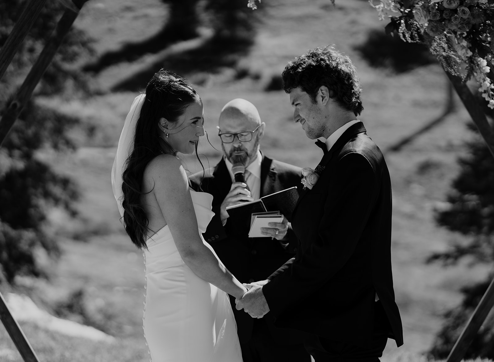 a bride and groom saying vows at their ski resort wedding.