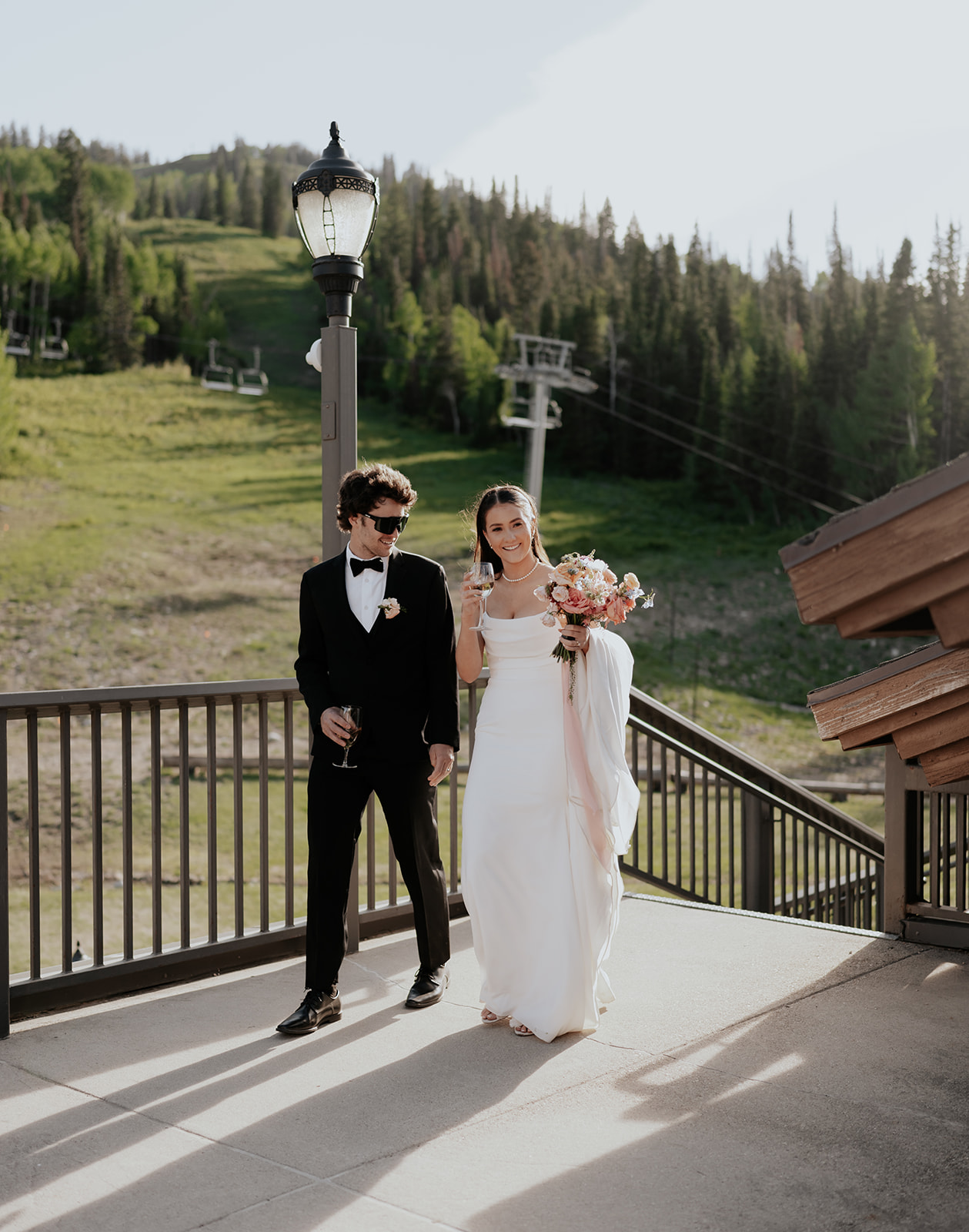 a bride and groom entering the cocktail hour of their ski resort wedding