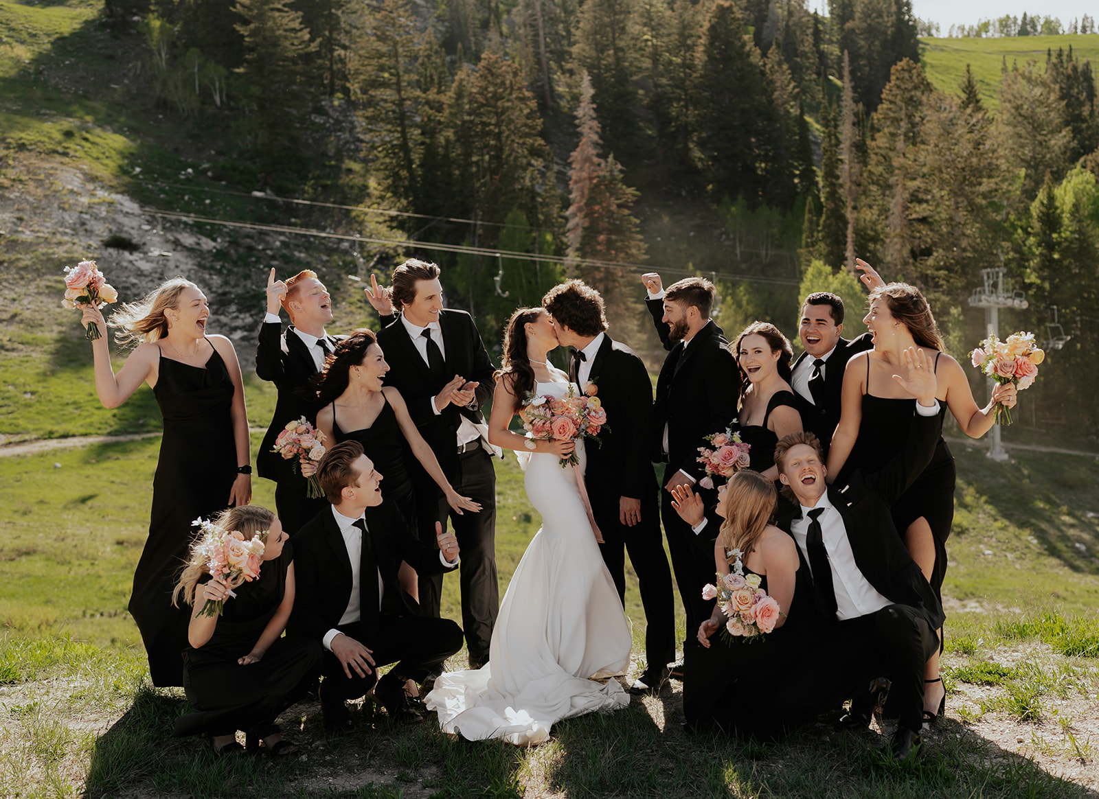 a bride and groom with their bridal part celebrating their wedding at a ski resort